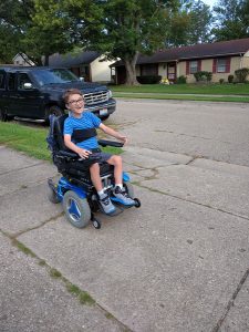 Liam racing around while we wait for his school bus.